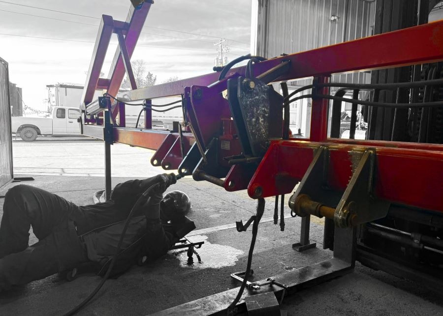 Agriculture Fabrication and Repair with red tractor tool bar